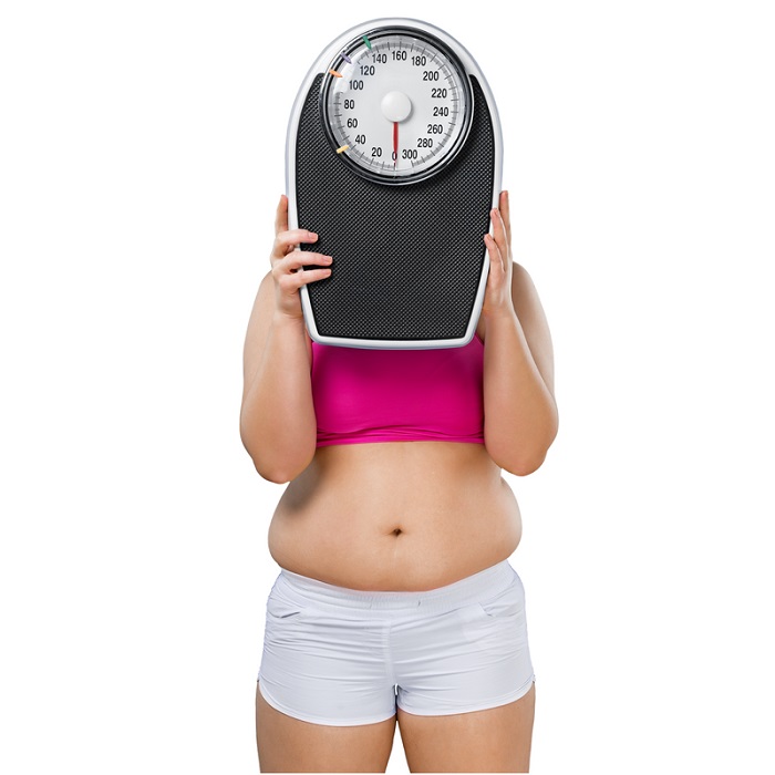 women with weighing machine